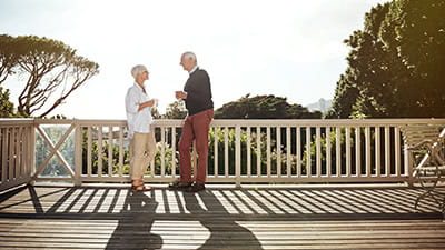 Shot of a senior couple having coffee together on their balcony at home