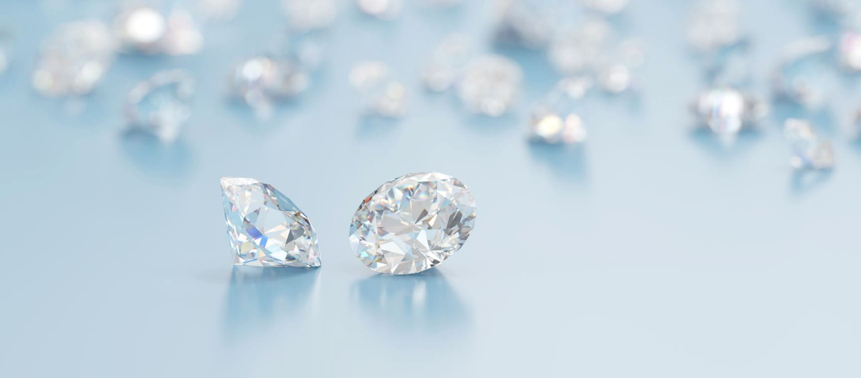 lab grown diamonds on a light blue surface