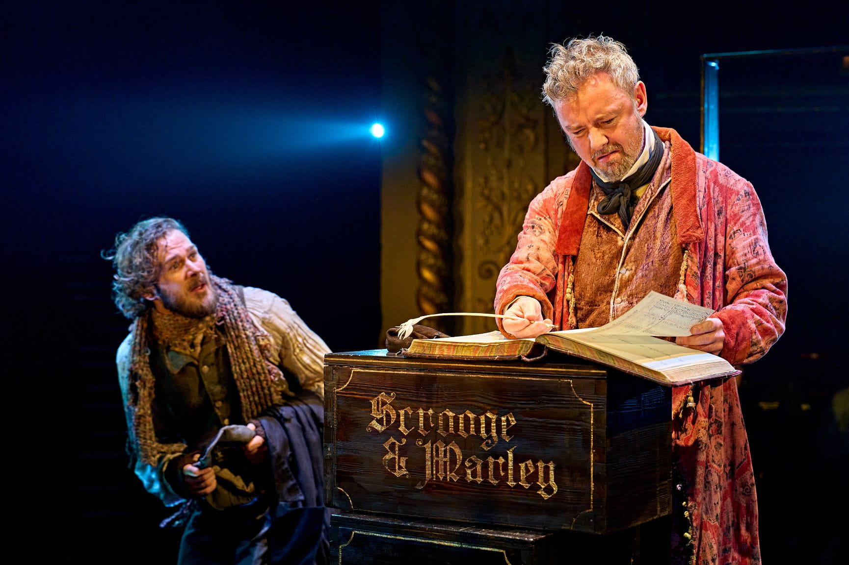 Rob Compton Bob Cratchit and John Simm Ebenezer Scrooge in A Christmas Carol at The Old Vic 