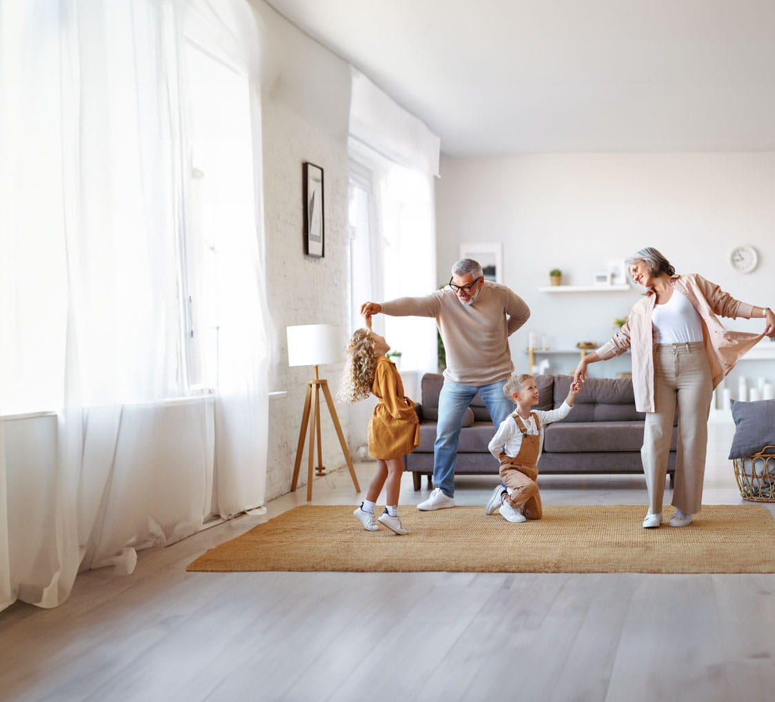 Grandparents dancing with their grandchildren