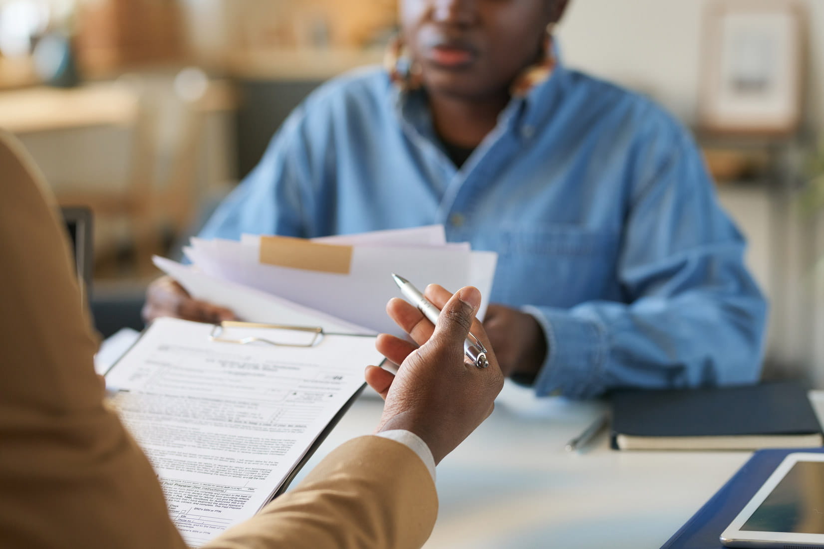 Two people looking at paperwork